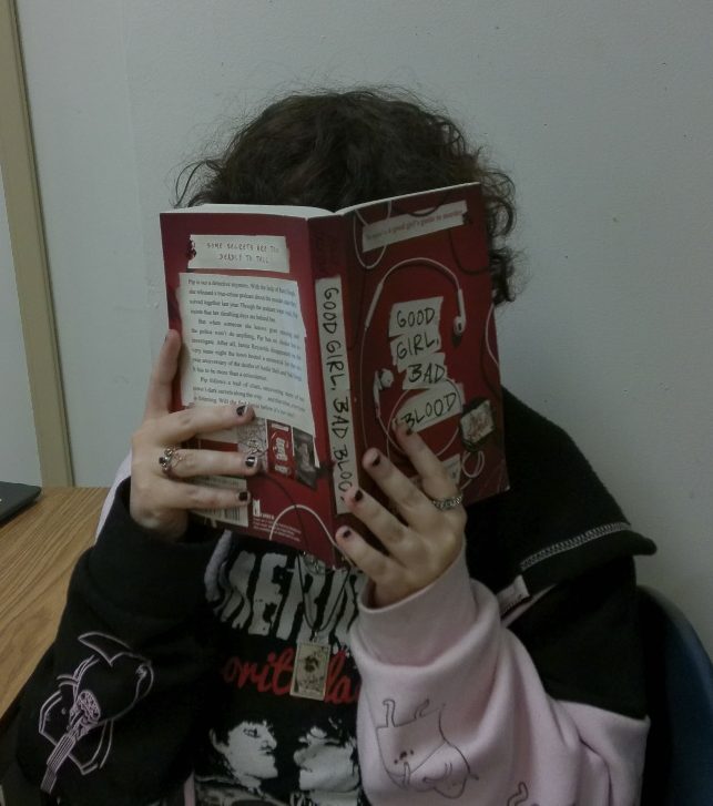 Junior Olivia “Ash” Perkins lost in a good book.