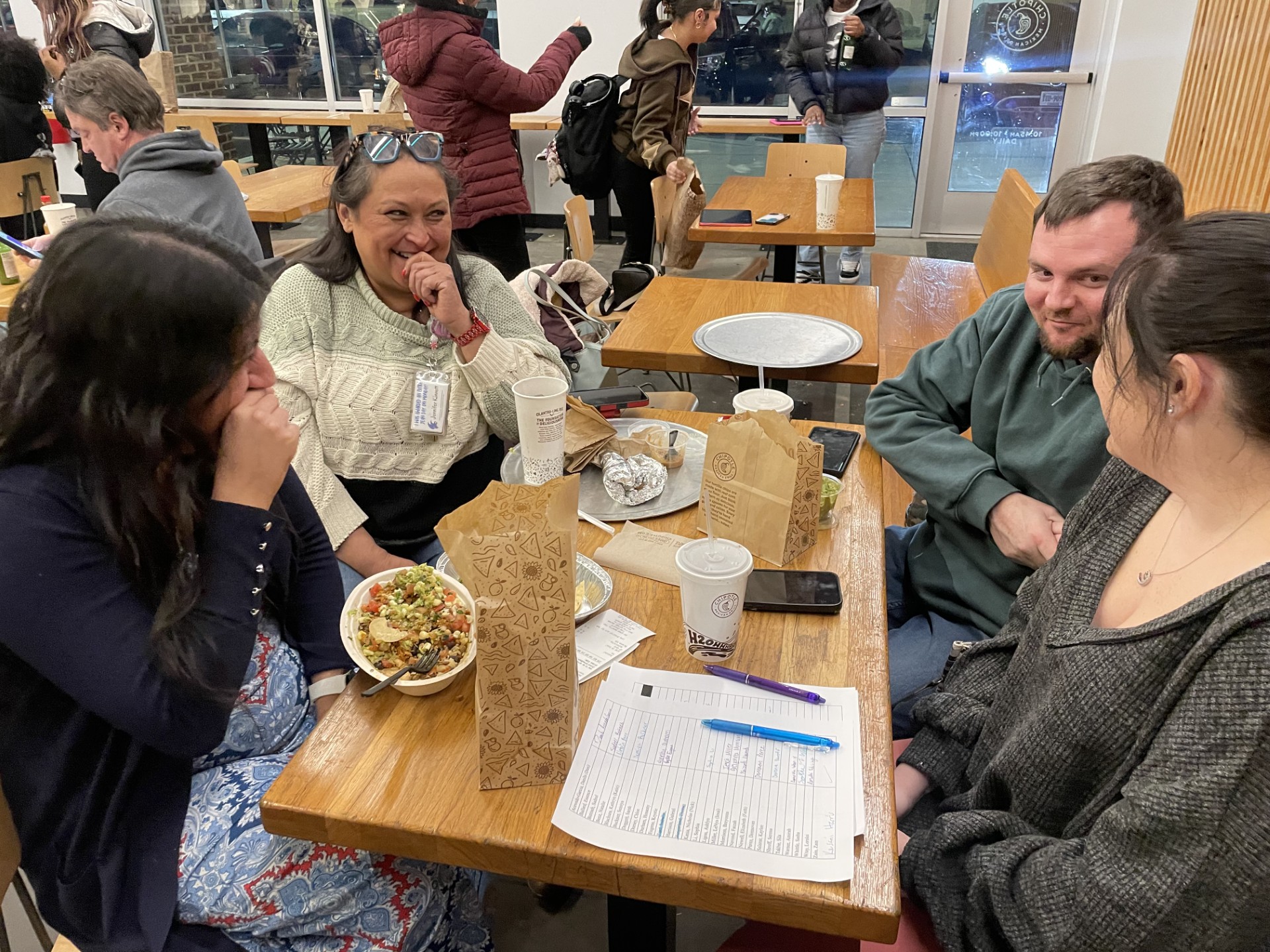 Teachers Jennifer Kinnett, Michelle Guzman, and Ashley Murphy enjoying their time at Chipotle with a couple of laughs.