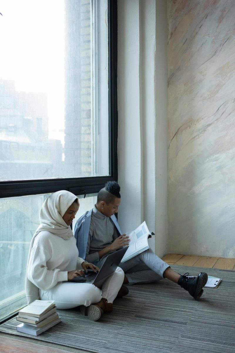 A Woman and a Man studying together on the floor