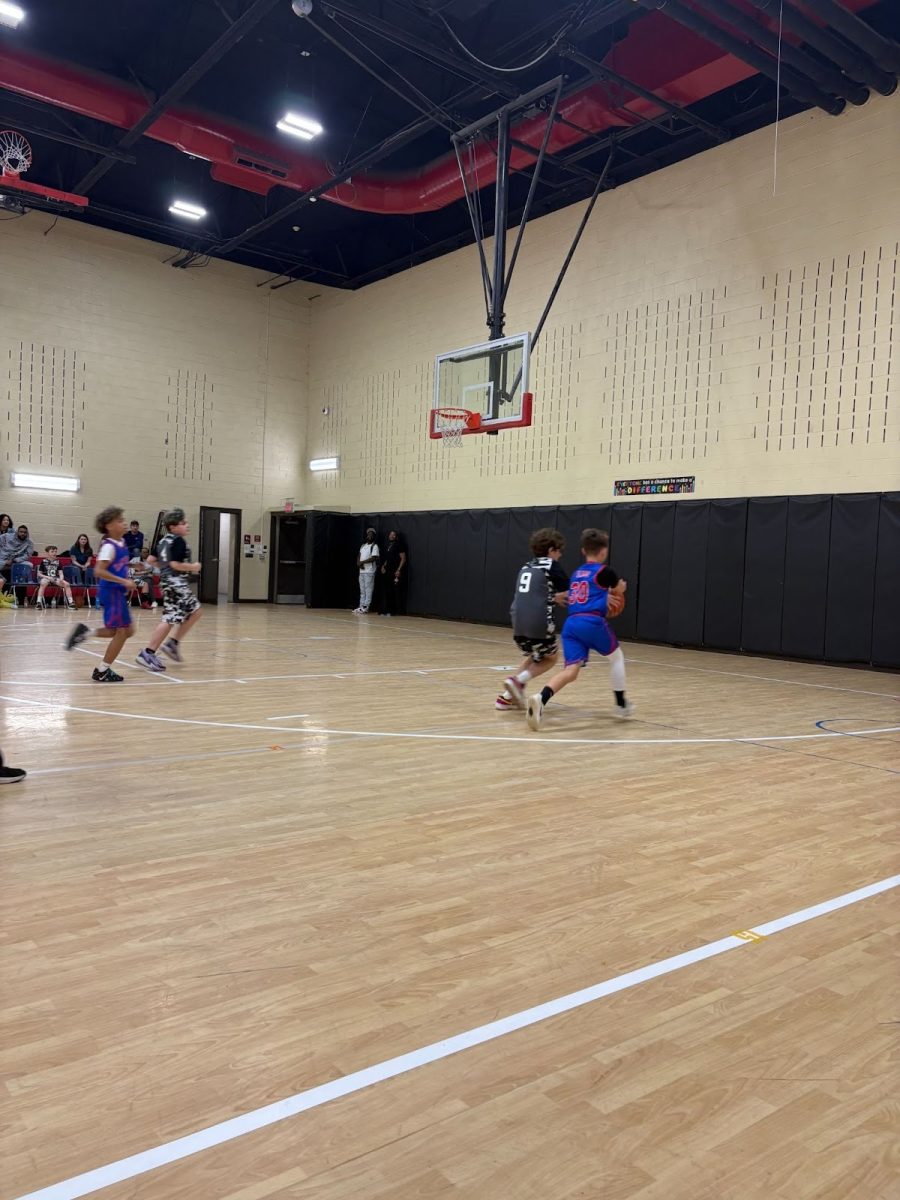 Dan River and Tunstall players playing basketball